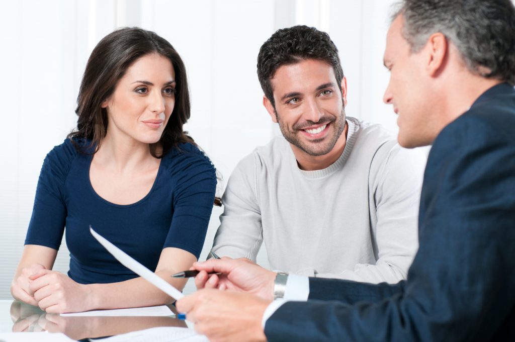 mortgage adviser talking to couple