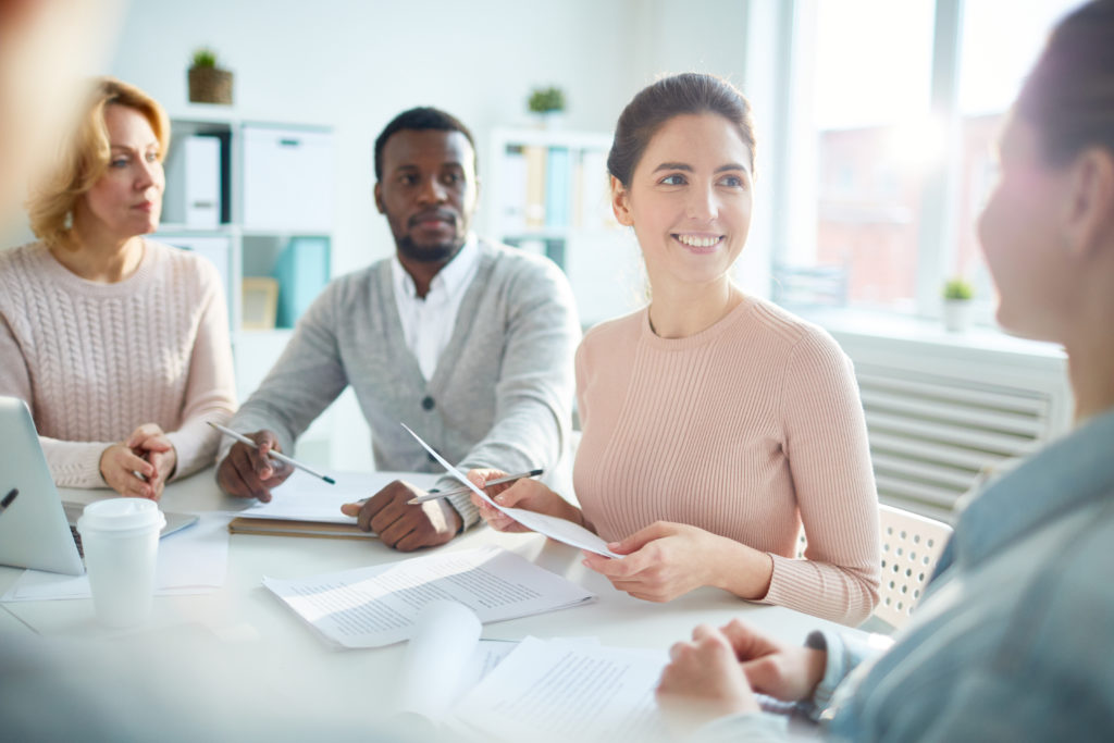 Business men and women at a meeting