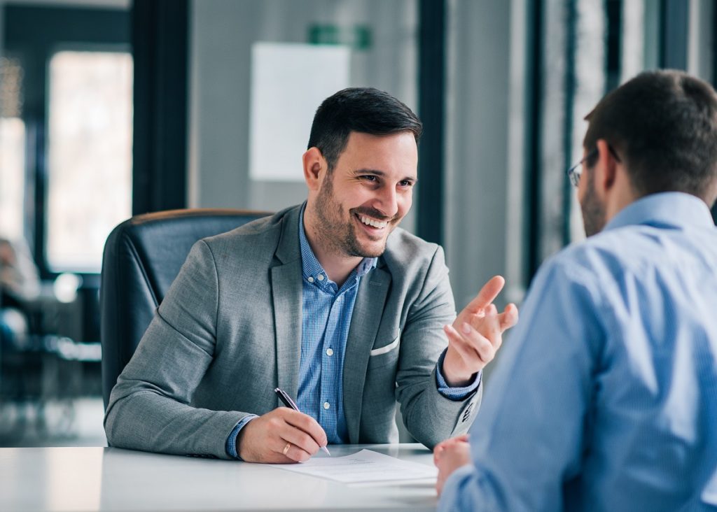 A financial adviser assisting someone with their money issues.