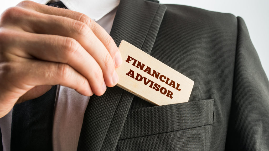 A financial advisor holds a job title badge