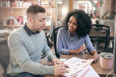 An IFA administrator working alongside a financial adviser.