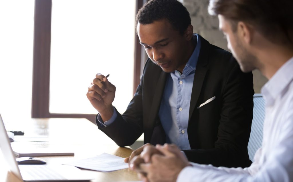 A mortgage adviser offering guidance to a client