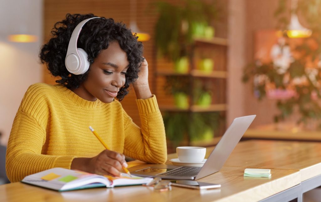 a student studies an online course on your laptop