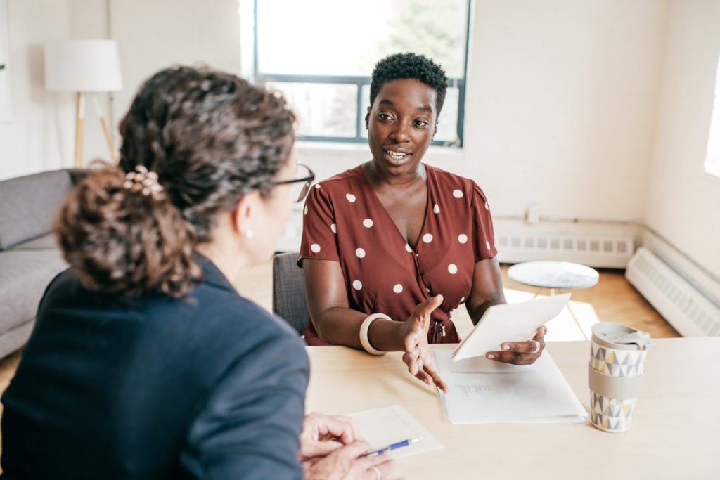 A financial planner talking with a client.