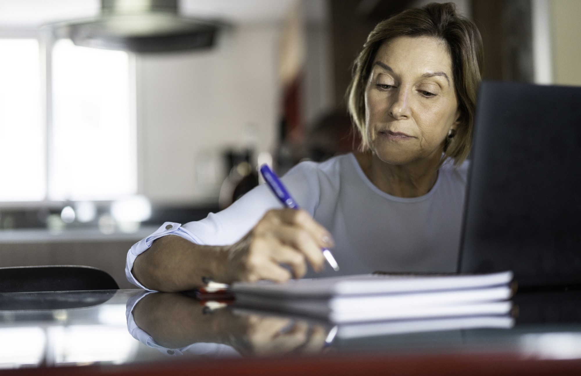 An older woman learning new skills later in life.