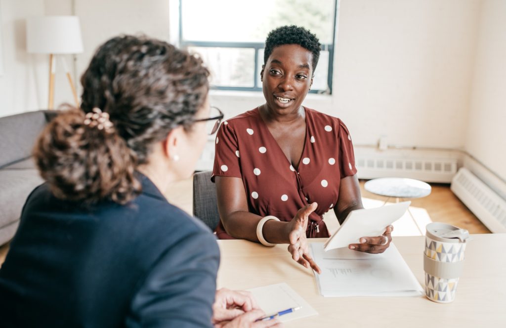 A financial planner offering expert advice to a business owner.