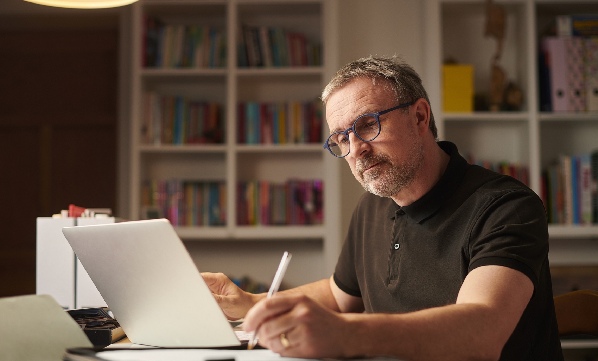 An older man learning a new skill through an online course.