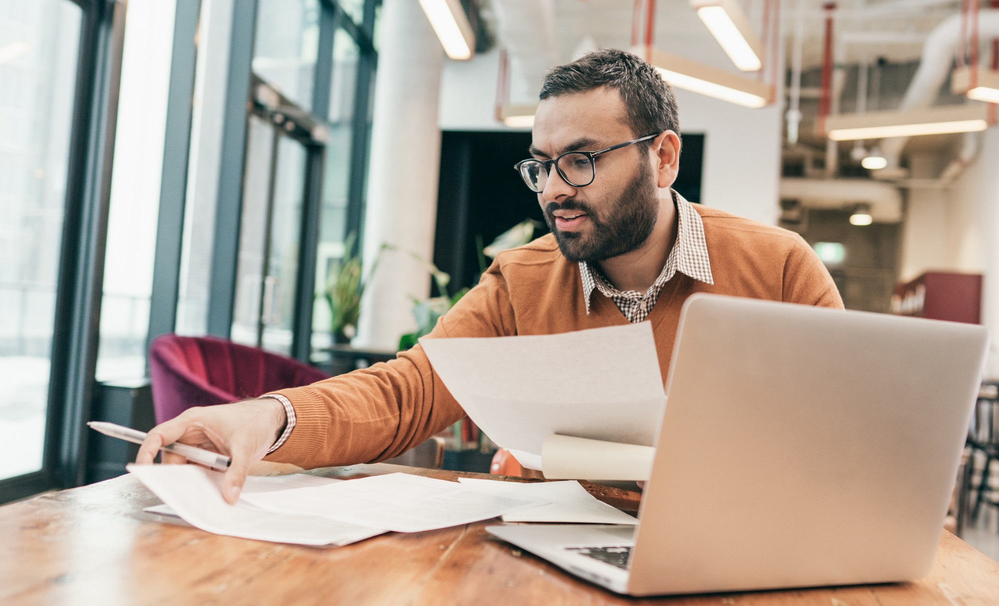 A paraplanner carrying out administrative tasks on behalf of a financial planner.