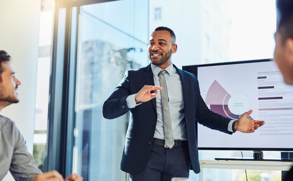 A paraplanner conducting a presentation in front of a client.