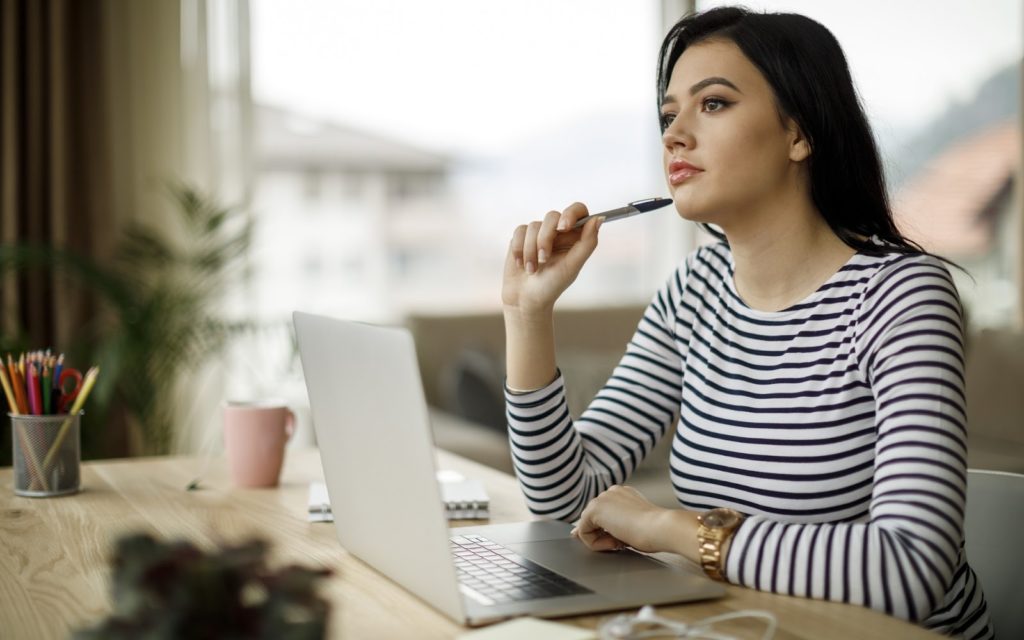 A woman in an office considering a career change.