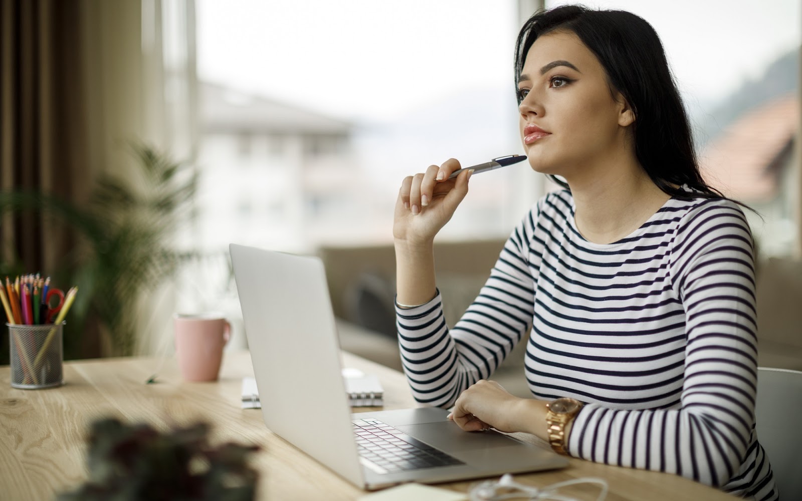 A woman in an office considering a career change.