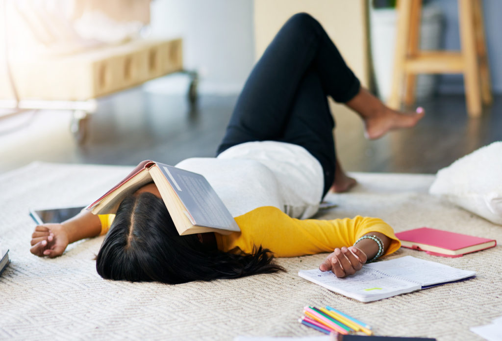 a young student takes a break from studying.