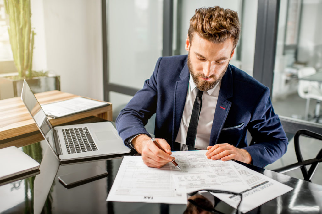 A young financial advisor in his office.