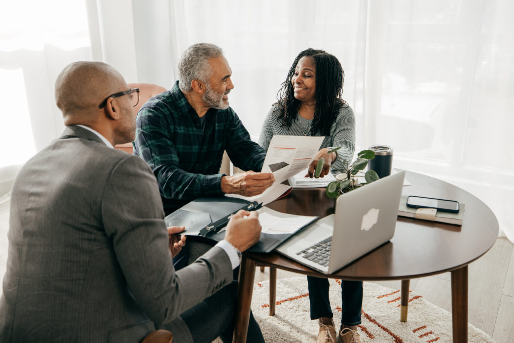 a mortgage adviser in a consultation with a couple.