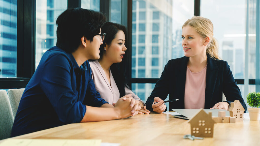 A newly qualified mortgage adviser meeting with clients.