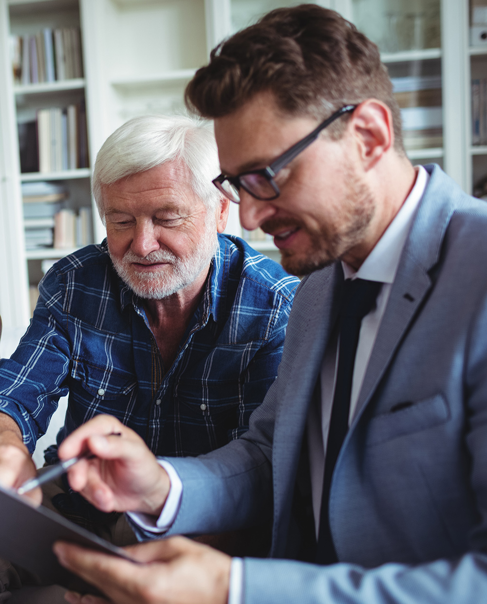 A financial adviser providing advice to a couple.