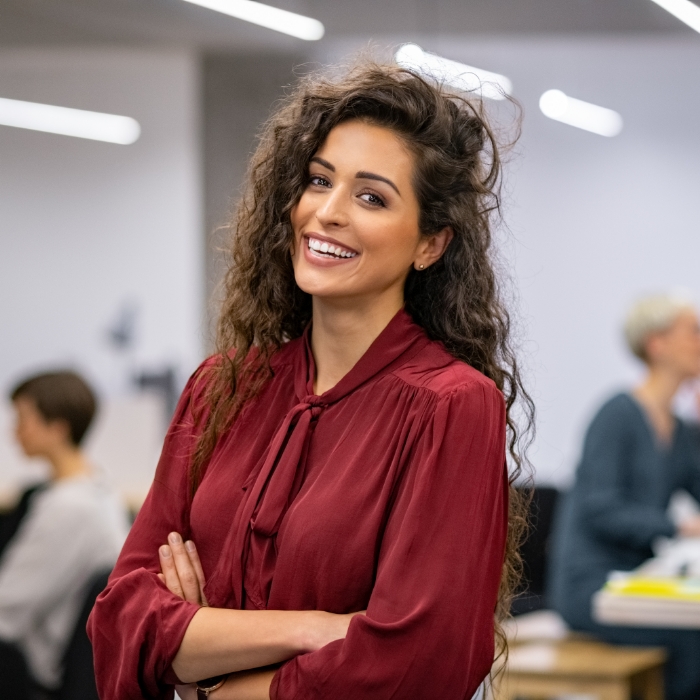 Young woman smiling in office environment