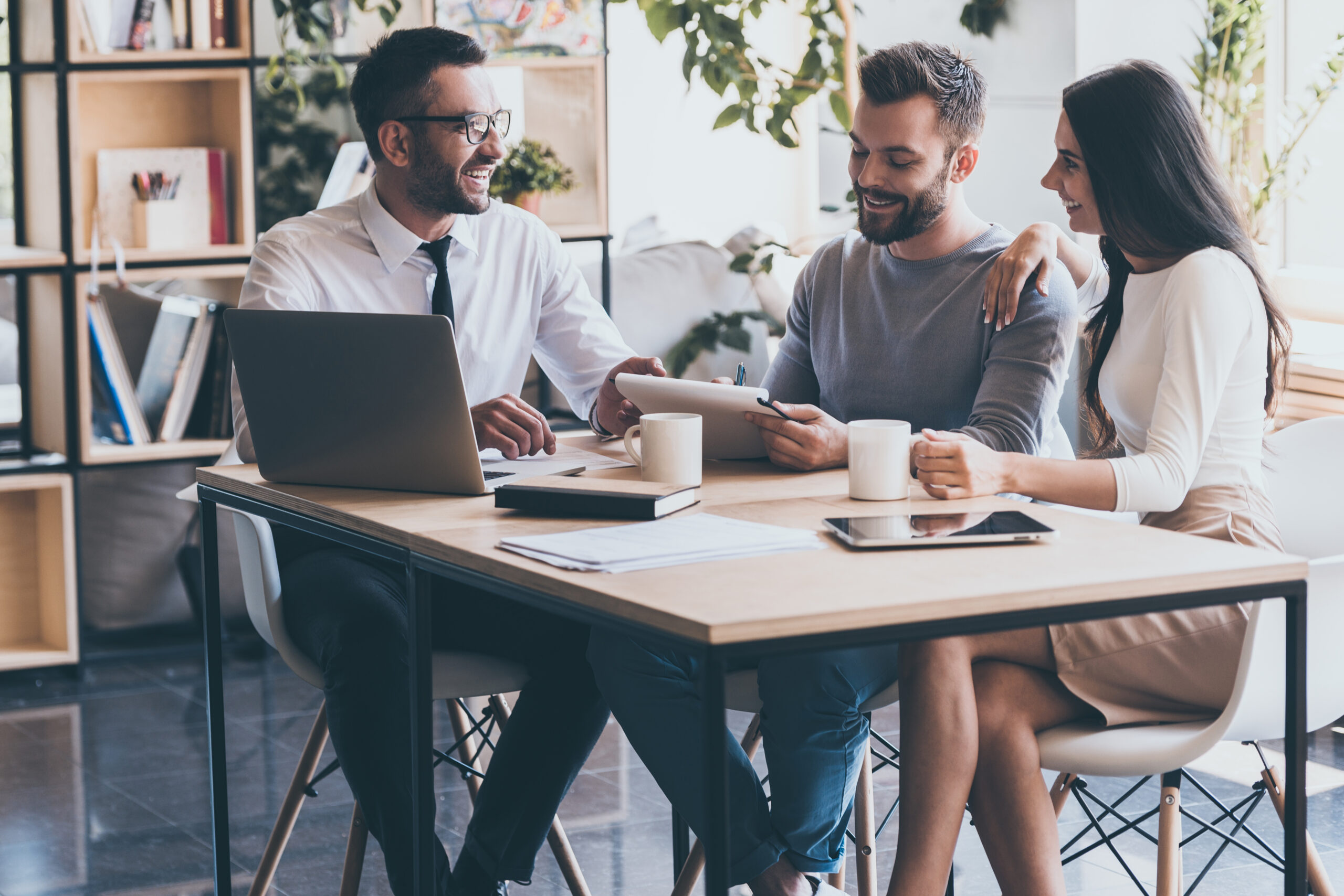 A young couple meeting with a mortgage adviser