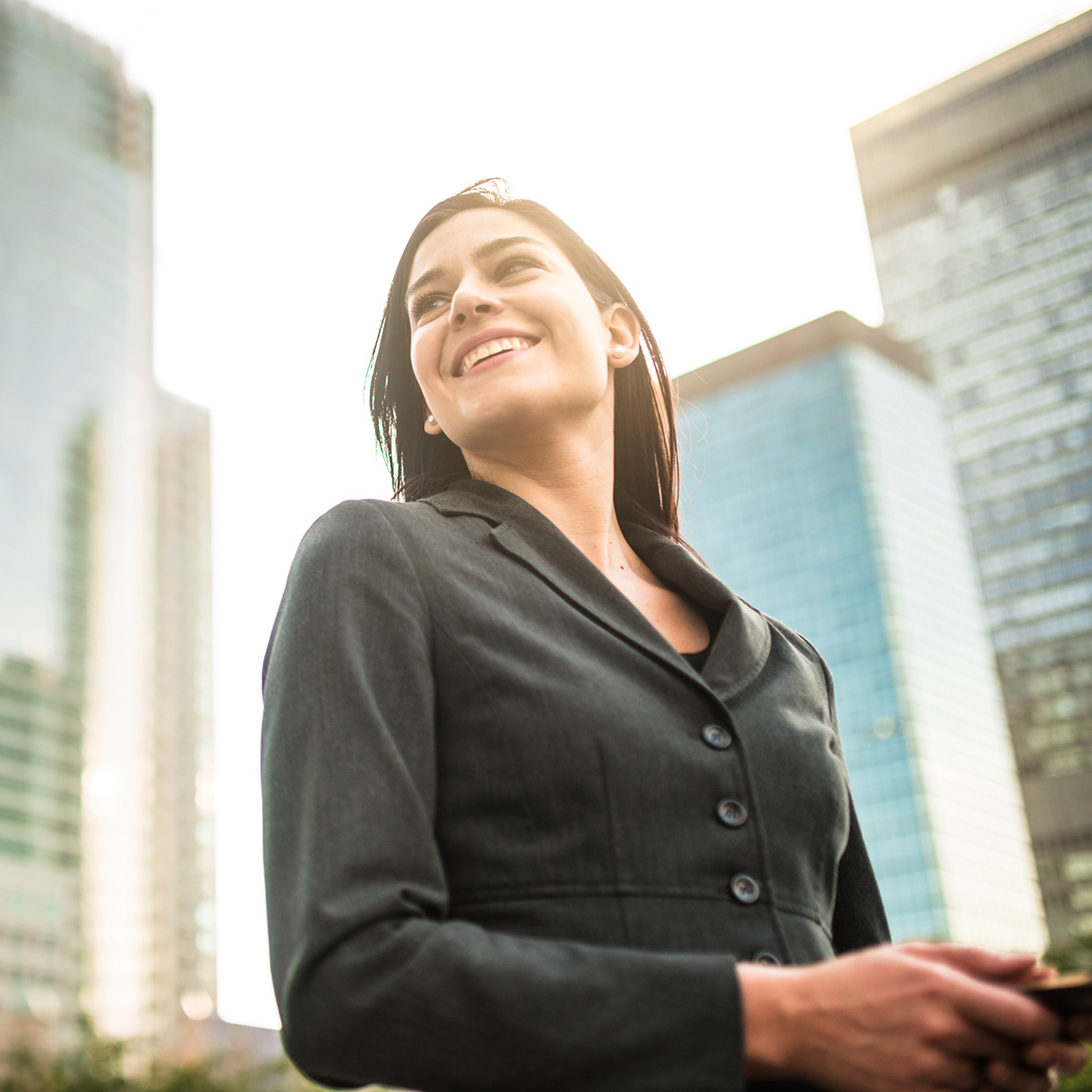 Smiling business woman in a city centre environment