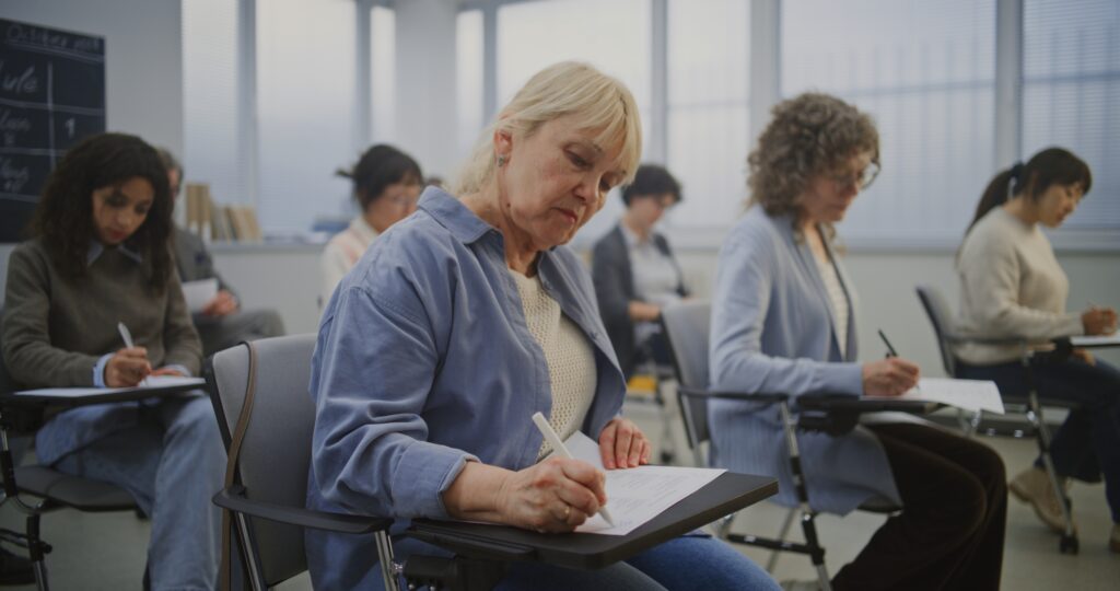 a group of mature students working in a classroom